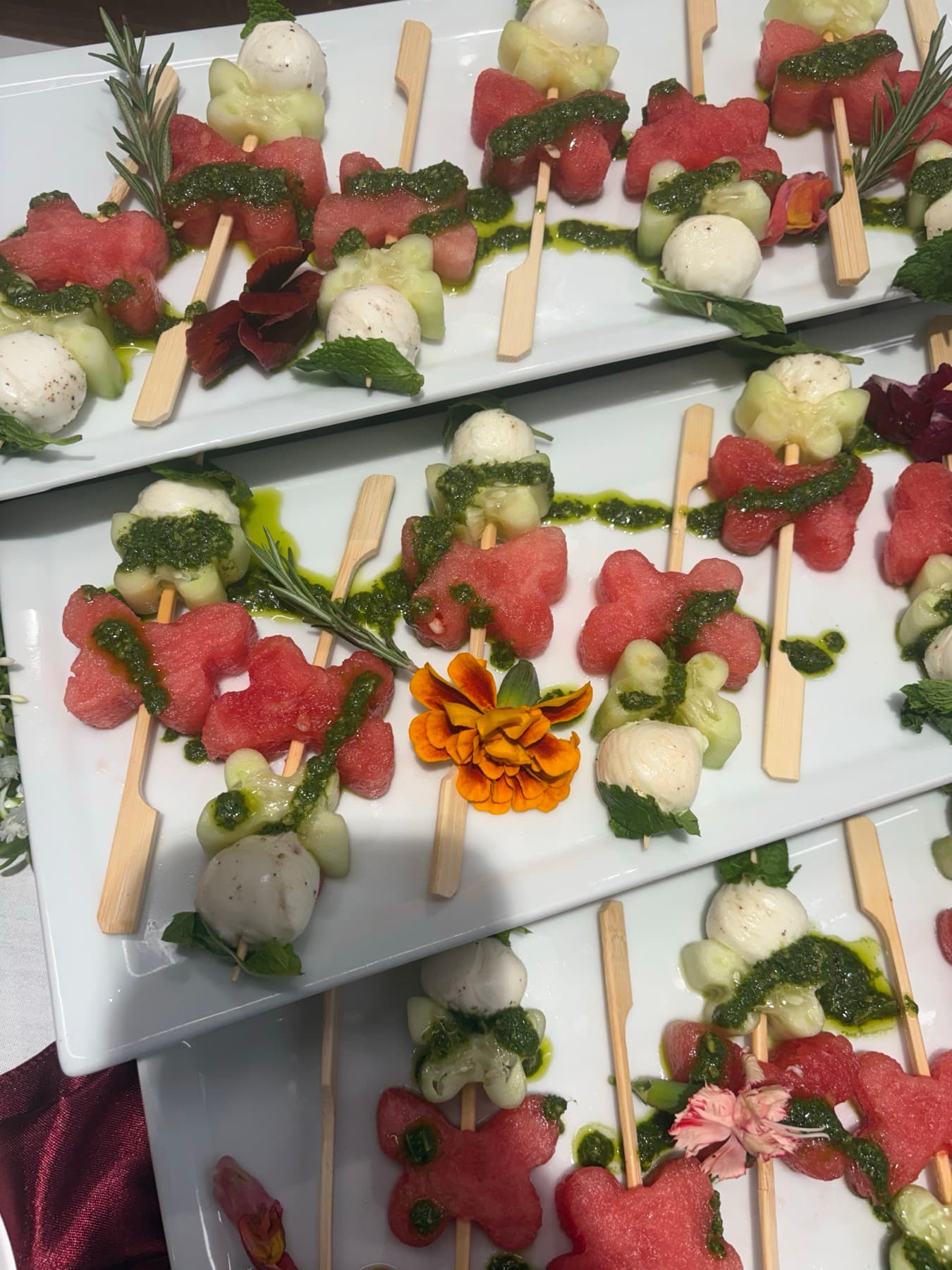 Beautifully plated appetizers with edible flowers at a building event